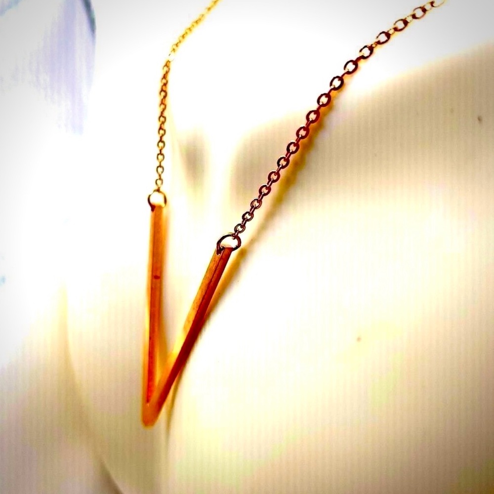 chain rose gold deep v shaped necklace is crafted from rose gold alloy